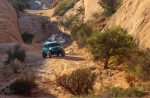 A Jeep explores Moab's famed four-wheel routes on an thrilling experience near Lionsback Resort.