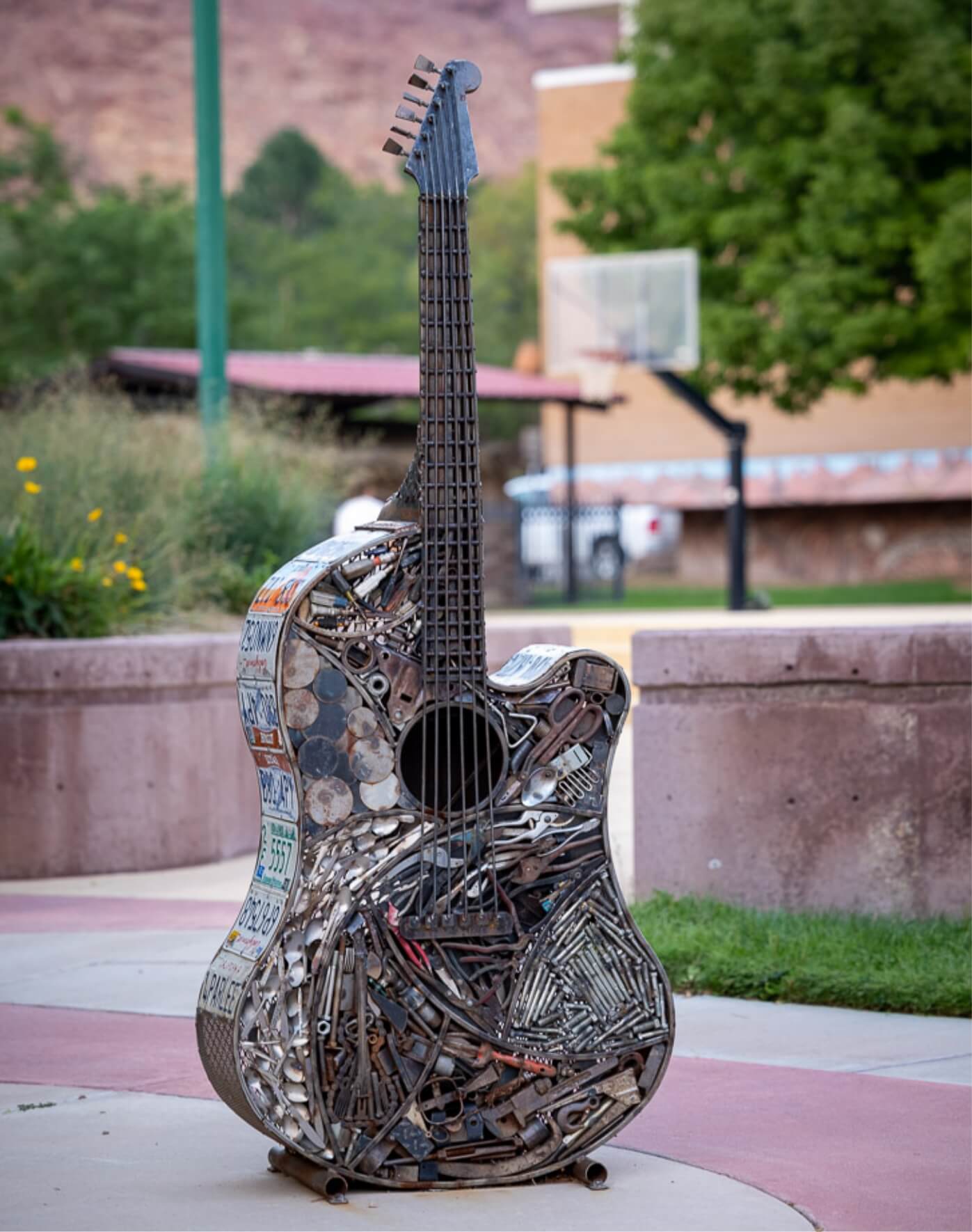 A sculpture of a guitar made from assorted metal scraps highlights Moab's connection to the arts.