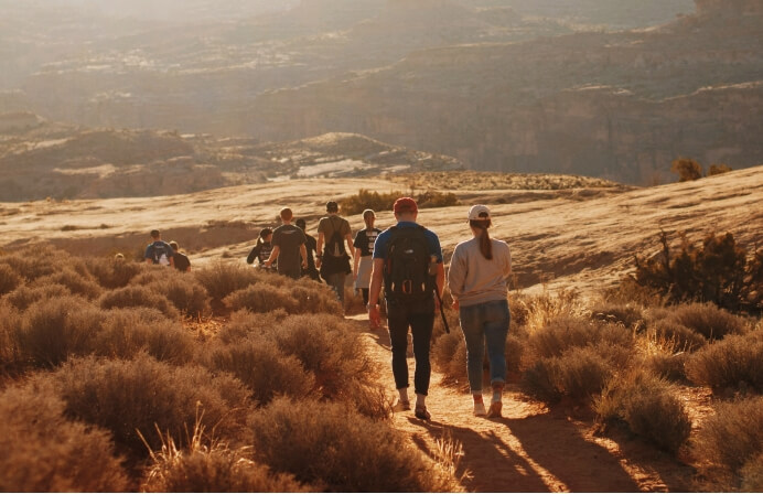 A group of hikers experiencing the beautiful hiking trails near Lionsback Resort in Moab.