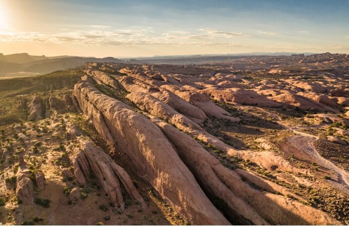 An aerial view of the sun kissed Moab desert surrounding Lionsback Resort.
